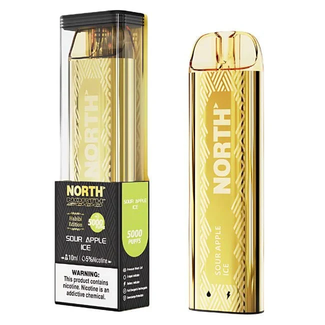 A sleek treezy vape device resting on a wooden surface with eucalyptus leaves nearby, showcasing its compact design